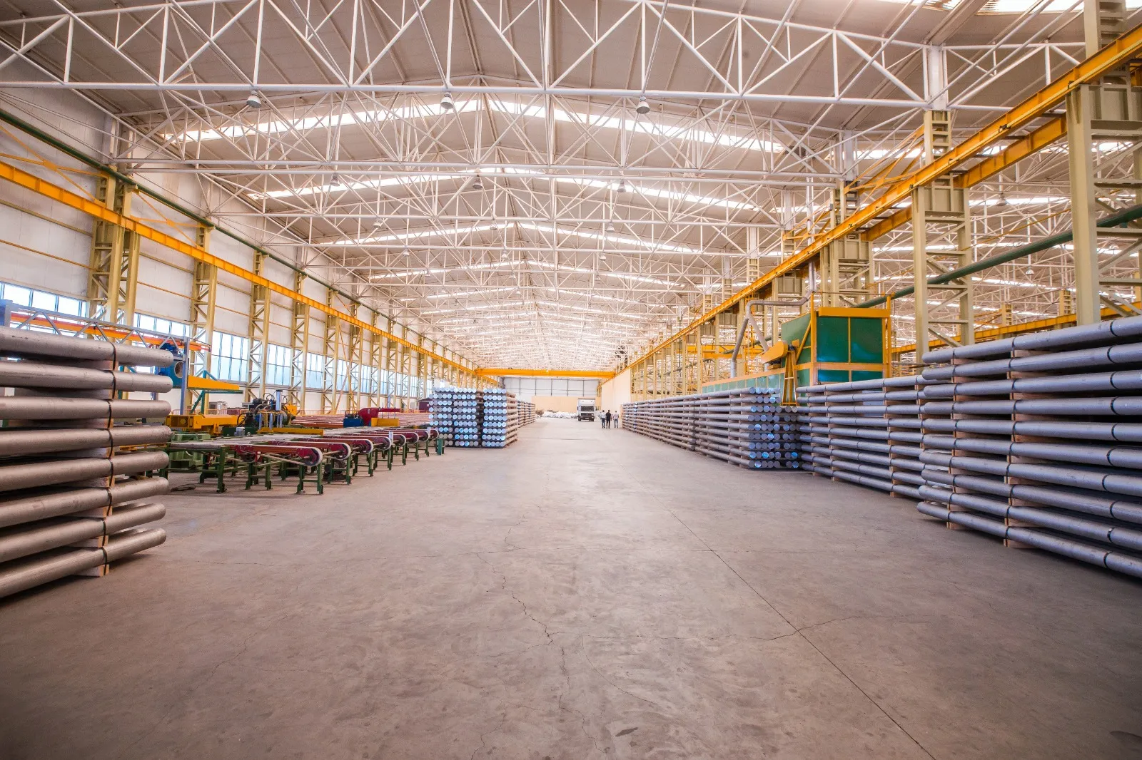 Large steel warehouse with stacked bars